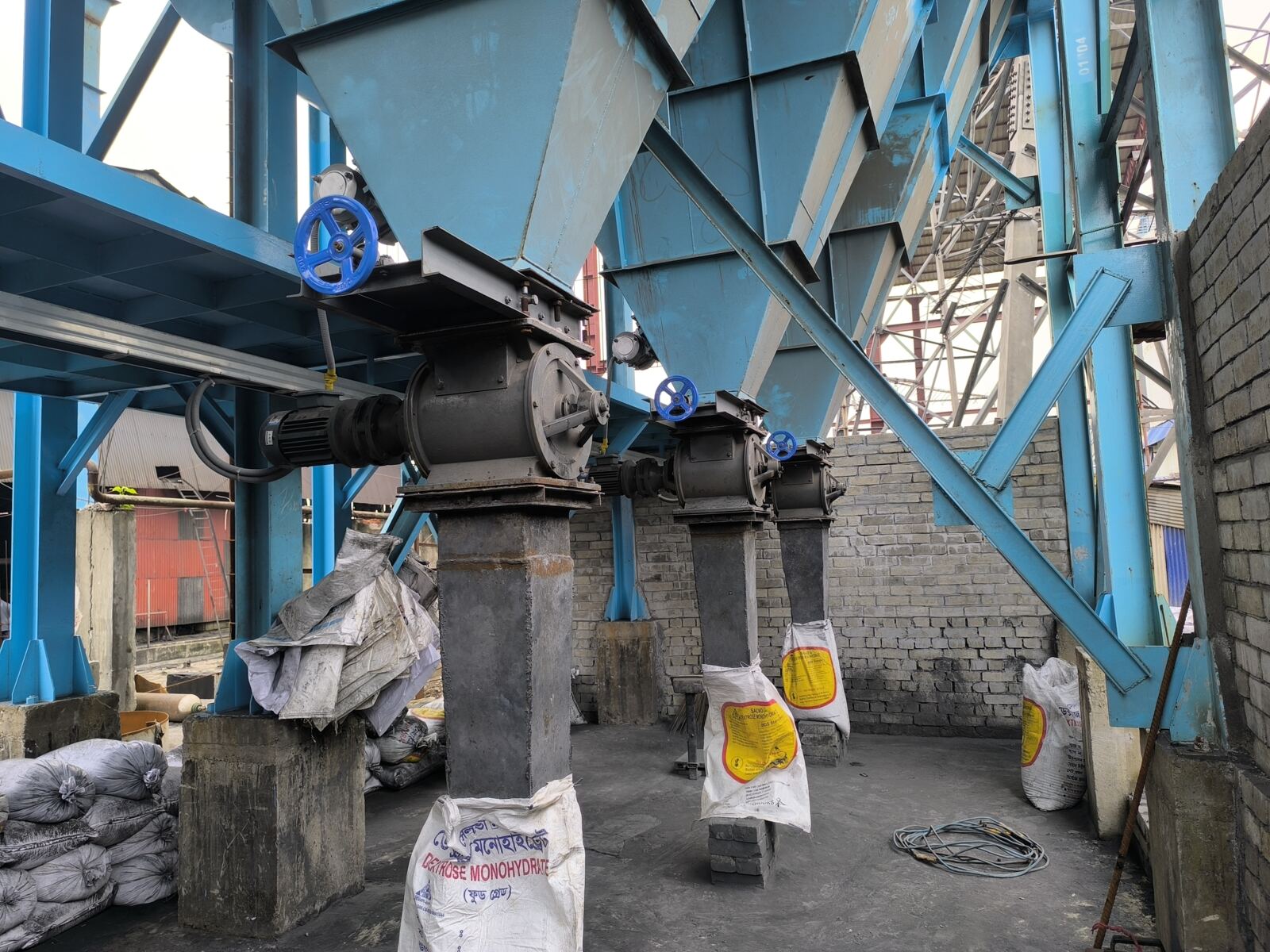 Bag house hoppers and rotary discharge valves