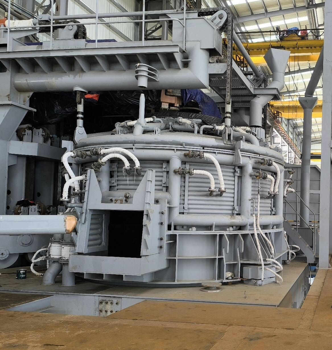 Ladle refining furnace with water-cooled roof and electrode arms